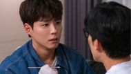 Dong-ju treating Jong-hyeon's wound (Image via Instagram @jtbcdrama)